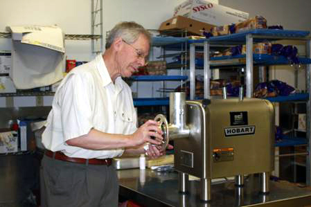 Mike Mistelske setting up the meat grinder